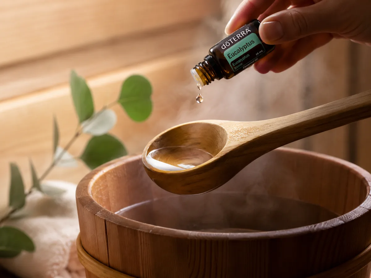 Kapka esenciálního oleje dōTERRA během saunového rituálu